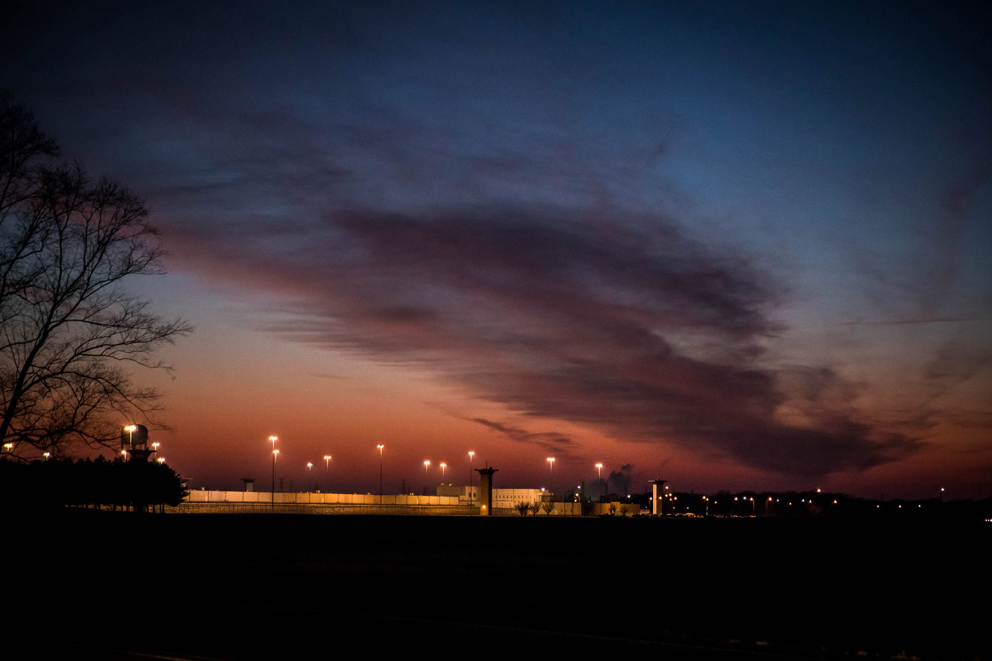 The sun sets over the federal penitentiary compound in Terre Haute, Indiana on the night of an execution